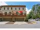 Exterior of a multi-story townhouse featuring a private deck, and two-car garage at 600 Luckett Ct, Smyrna, GA 30080