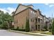 Brick townhome with manicured landscaping, offering curb appeal and a welcoming entrance at 600 Luckett Ct, Smyrna, GA 30080