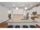 Spacious kitchen island with seating, stainless steel appliances and modern white cabinetry at 600 Luckett Ct, Smyrna, GA 30080