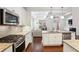 Modern kitchen featuring stainless steel appliances, granite countertops, and ample cabinet space at 600 Luckett Ct, Smyrna, GA 30080