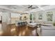 Open concept living space featuring hardwood floors, coffered ceilings, and abundant natural light at 600 Luckett Ct, Smyrna, GA 30080
