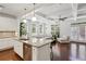 Bright open-plan living space with hardwood floors, connecting kitchen and living room at 600 Luckett Ct, Smyrna, GA 30080