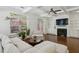 Inviting living room featuring a fireplace, built-in shelving, and lots of natural light at 600 Luckett Ct, Smyrna, GA 30080