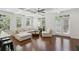 Spacious living room with hardwood floors, coffered ceiling, and abundant natural light at 600 Luckett Ct, Smyrna, GA 30080