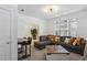 Living room with a gray couch, a wooden coffee table, and a dark wooden table with chairs at 600 Luckett Ct, Smyrna, GA 30080