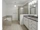 Spacious main bathroom features a soaking tub, a glass-enclosed shower, and dual vanity sinks at 600 Luckett Ct, Smyrna, GA 30080