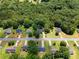 Aerial view of a tree-lined neighborhood with well-maintained lawns and varied home styles at 90 Cypress Dr, Covington, GA 30016