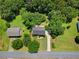 Aerial view of a well-maintained property surrounded by lush greenery and mature trees at 90 Cypress Dr, Covington, GA 30016