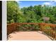 Exterior wood back deck overlooking a peaceful backyard at 90 Cypress Dr, Covington, GA 30016