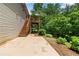 Backyard with a deck and wooden stairs, plus some greenery at 90 Cypress Dr, Covington, GA 30016