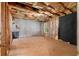 Unfinished basement space ready for transformation, with insulation and a window for natural light at 90 Cypress Dr, Covington, GA 30016