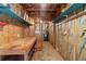 Unfinished basement with workbench and utilities ready for future customization at 90 Cypress Dr, Covington, GA 30016