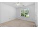 Bright bedroom with natural light, window and neutral carpeting at 90 Cypress Dr, Covington, GA 30016