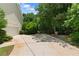 Spacious driveway leading to the garage with potential for extra parking or recreational activities at 90 Cypress Dr, Covington, GA 30016