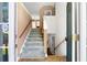 Inviting entryway featuring stairs leading upstairs and downstairs at 90 Cypress Dr, Covington, GA 30016