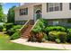 Close up of front entrance with beautiful landscaping and a cozy, welcoming feel at 90 Cypress Dr, Covington, GA 30016