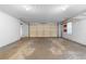 Two car garage with ample space for vehicles and storage at 90 Cypress Dr, Covington, GA 30016