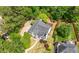 Aerial view of residence featuring well-maintained landscape and mature trees at 9206 Denmeade Trce, Douglasville, GA 30135