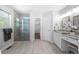 Bathroom featuring a large glass enclosed shower and double vanity at 9206 Denmeade Trce, Douglasville, GA 30135
