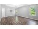 Bright bedroom with tray ceilings, vinyl floors, and natural light at 9206 Denmeade Trce, Douglasville, GA 30135