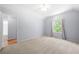Spacious bedroom featuring a vaulted ceiling and large window at 9206 Denmeade Trce, Douglasville, GA 30135
