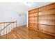 Spacious bonus room with hardwood floors and built in shelving at 9206 Denmeade Trce, Douglasville, GA 30135