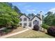 Charming two-story home with landscaped front yard and inviting walkway at 9206 Denmeade Trce, Douglasville, GA 30135