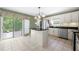 Bright kitchen with an island, stainless steel appliances, and a sliding door to a back deck at 9206 Denmeade Trce, Douglasville, GA 30135