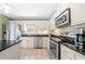 Well-equipped kitchen with stainless steel appliances, granite countertops, and ample cabinet space at 9206 Denmeade Trce, Douglasville, GA 30135