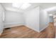 Bright living room with hardwood floors, white walls, and natural light from the front door at 9206 Denmeade Trce, Douglasville, GA 30135