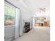 Expansive living room with a fireplace, upstairs balcony, and large windows overlooking the backyard at 9206 Denmeade Trce, Douglasville, GA 30135