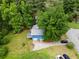 Aerial view of the home, showing the roof, deck, and surrounding yard at 35 Pawn Dr, Carrollton, GA 30116
