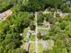 Aerial shot showcases a residential neighborhood with mature trees and spacious lawns at 35 Pawn Dr, Carrollton, GA 30116