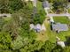 An aerial view of the home nestled in a neighborhood setting with mature trees at 35 Pawn Dr, Carrollton, GA 30116