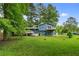 Two-story home featuring a spacious backyard with a deck and balcony at 35 Pawn Dr, Carrollton, GA 30116