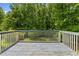 Exterior of home showing rear deck and wooded view at 35 Pawn Dr, Carrollton, GA 30116