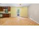 Open concept dining room featuring light-colored walls, hardwood floors, and a back door with glass at 35 Pawn Dr, Carrollton, GA 30116