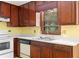 Fully equipped kitchen featuring stainless steel appliances, solid surface countertops and wood cabinets at 35 Pawn Dr, Carrollton, GA 30116