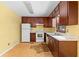 Functional kitchen featuring updated white appliances, hardwood floors, and ample counter space at 35 Pawn Dr, Carrollton, GA 30116