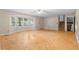 View of living room with parquet floors, fan, window, stairs and exterior door at 35 Pawn Dr, Carrollton, GA 30116