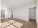 Bright bedroom boasting hardwood floors, white trim, and doors leading to a bathroom and walk-in closet at 48 Lakeview Pt, Dallas, GA 30157