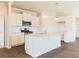 A well-lit kitchen with white cabinetry, stainless steel appliances, granite countertops, and a central island at 48 Lakeview Pt, Dallas, GA 30157