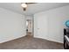 This spare bedroom includes neutral walls, a ceiling fan, and carpeted floors to accommodate any decor at 6977 Demeter Dr, Atlanta, GA 30349
