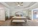 Serene main bedroom with large bed, bedside tables, and a bright window at 6977 Demeter Dr, Atlanta, GA 30349