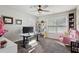 Bright and modern home office with two desks, large window, comfortable seating, and stylish decor at 6977 Demeter Dr, Atlanta, GA 30349