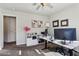 Bright home office featuring a large desk, dual monitors, diplomas, and carpeted floors at 6977 Demeter Dr, Atlanta, GA 30349