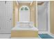 Bathroom with white cabinets, soaking tub, and shower at 8035 Canter Ln, Alpharetta, GA 30009