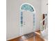 Bright foyer featuring an arched window over the front door and decorative stained-glass side windows at 8035 Canter Ln, Alpharetta, GA 30009