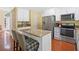 A kitchen featuring granite countertops, stainless steel appliances and hardwood floors at 8035 Canter Ln, Alpharetta, GA 30009