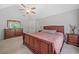 Spacious main bedroom features a ceiling fan, vaulted ceiling, carpet, and lots of sunlight at 8035 Canter Ln, Alpharetta, GA 30009